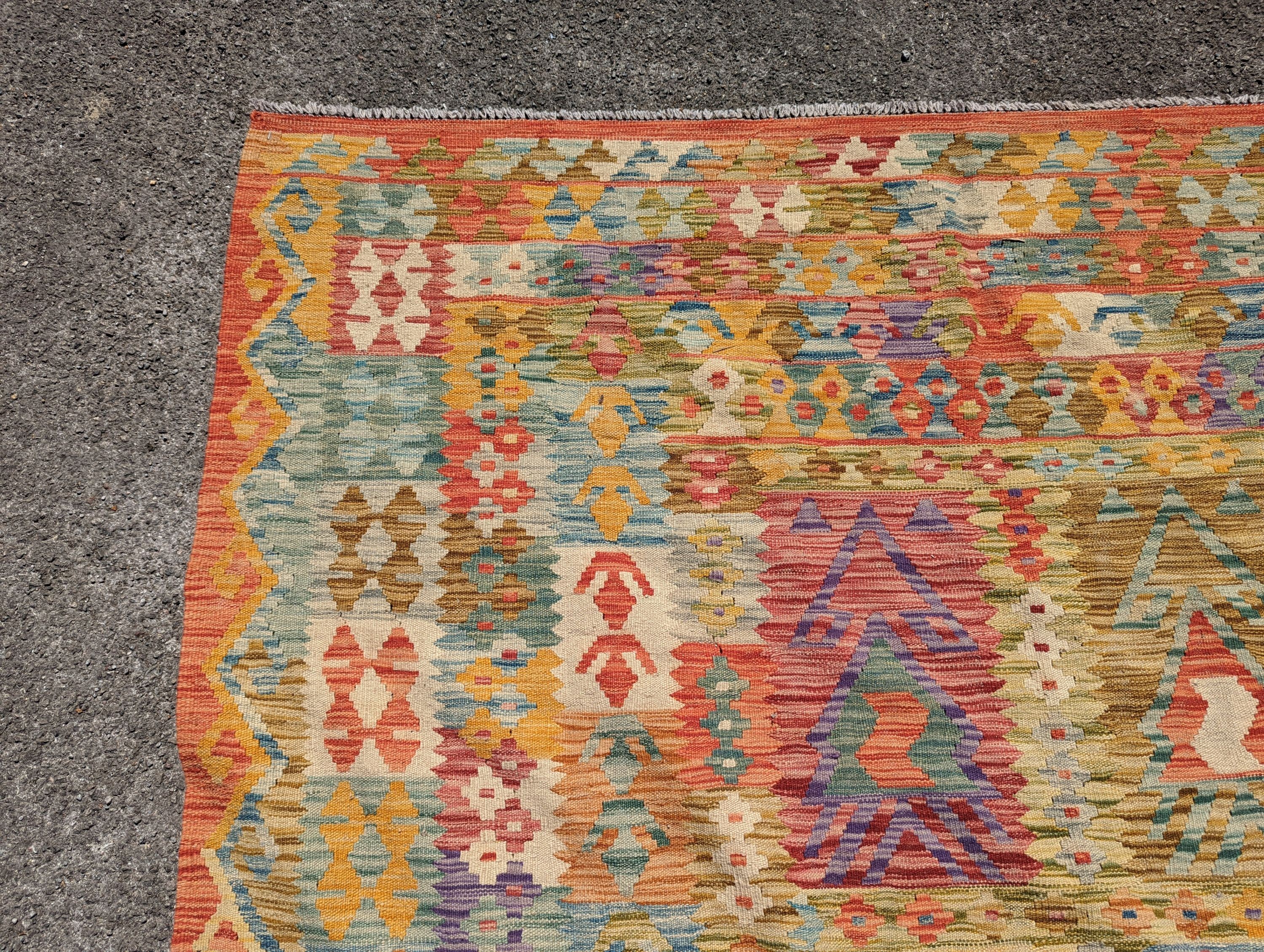 An Anatolian polychrome geometric flatweave Kilim carpet, 290 x 210cm